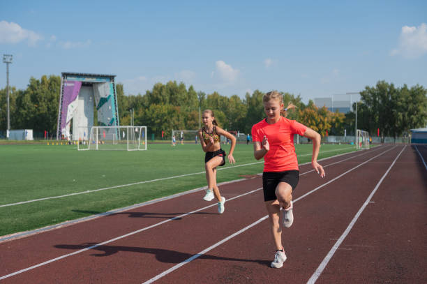 istock Two athlete young girl runner at the stadium 2170475222