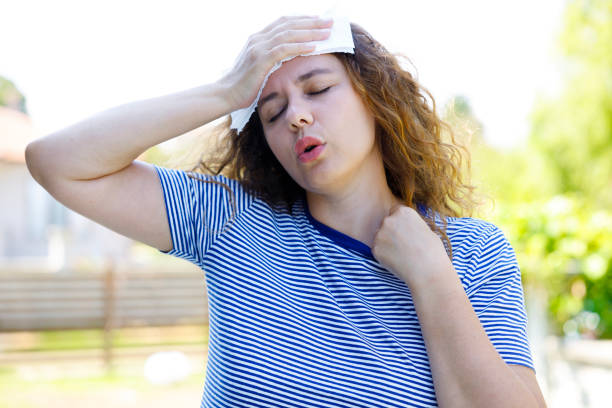 istock Young woman having hot flash and sweating in a warm summer day 2170476170
