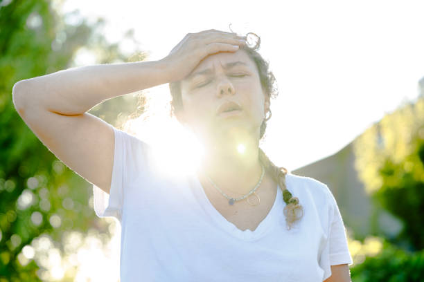 istock Young woman having hot flash and sweating in a warm summer day 2170476216