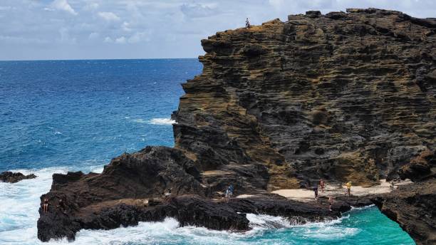 istock Exploring rocky coastline and cliffs by the ocean on a sunny day. 2170476591