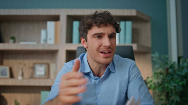 istock Dissatisfied man shouting call online closeup. Pov view nervous boss talking web 2170478991