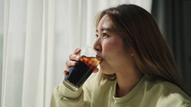 istock Woman enjoy drinking cola. 2170479626
