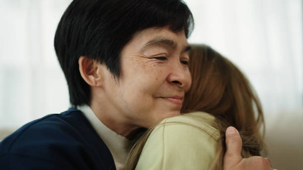 istock Mother and daughter hugging and kissing. 2170479788