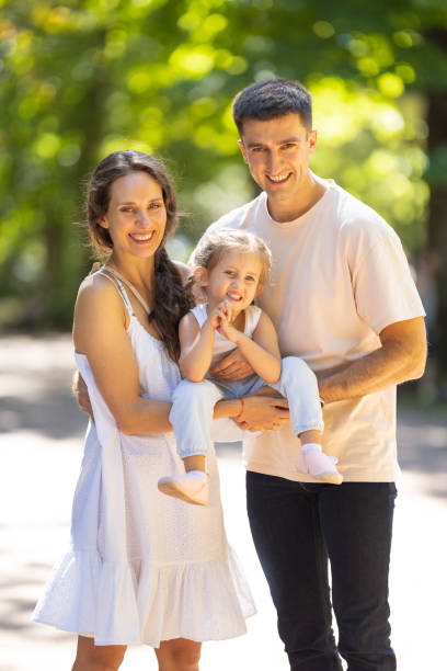 istock Smiling happy family in the park 2170479837
