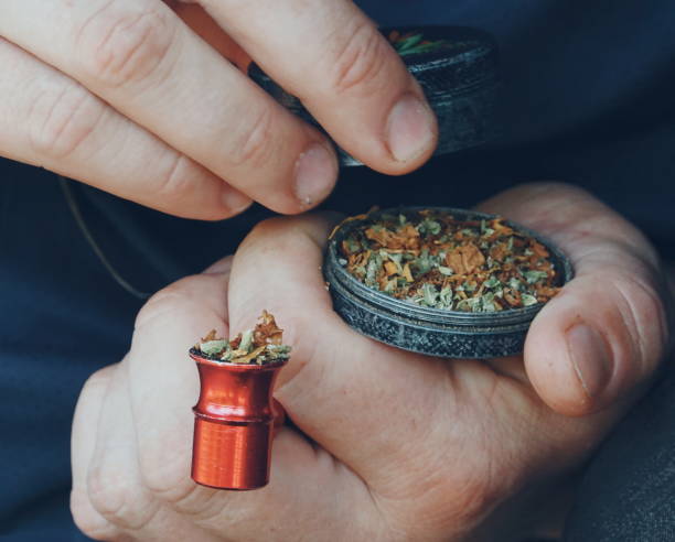 istock Herbal Tobacco In Grinder Close-Up Hands Holding 2170480321
