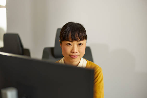istock Japanese businesswoman working on PC in the office. 2170481976