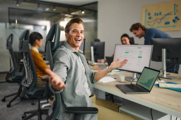 istock Happy male web designer working on computers in the office. 2170482113