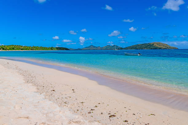 istock Boats at the tropical sandy beach 2170482144