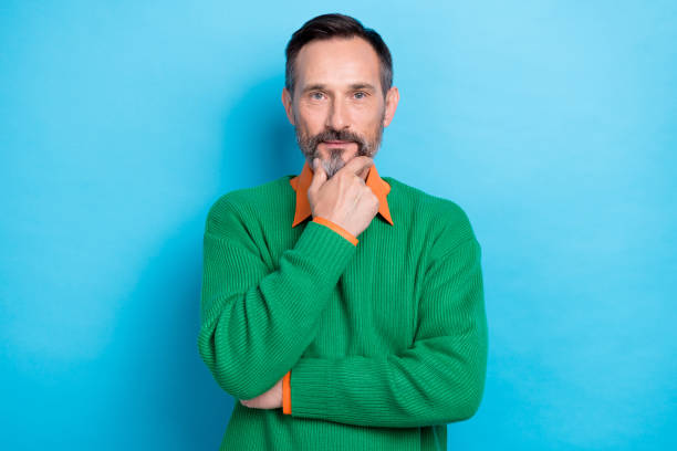 istock Portrait of minded creative person hand touch chin decision solution isolated on blue color background 2170483330