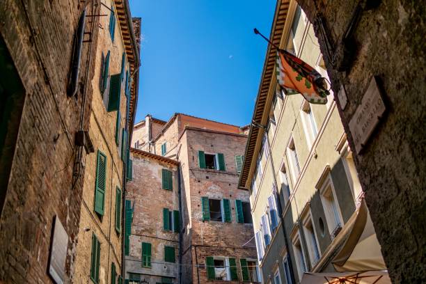 istock Charming alley in Siena with historic buildings 2170483452