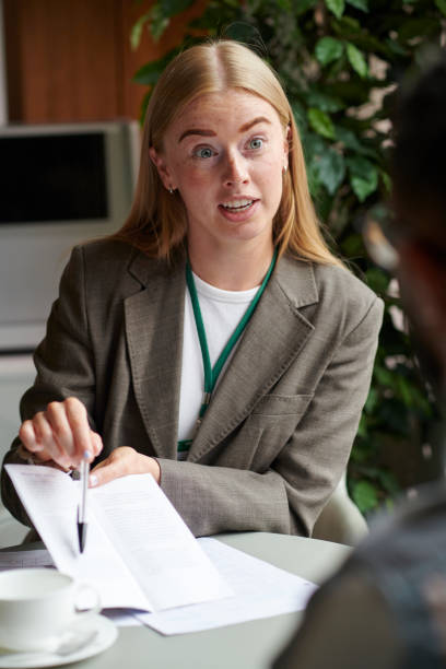 istock housing officer assisting a tenant with forms 2170483820