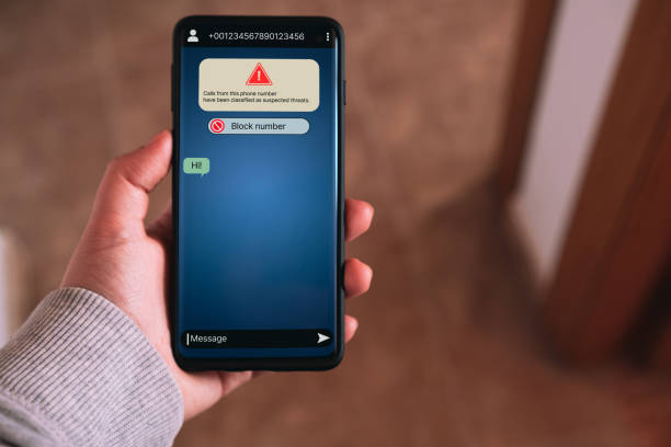 istock Woman receives message from suspected number scam. 2170484008