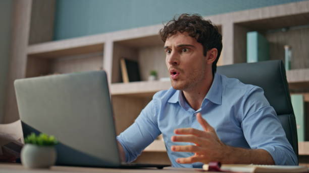 istock Angry boss shouting web conference online. Closeup frustrated man talking video 2170488329