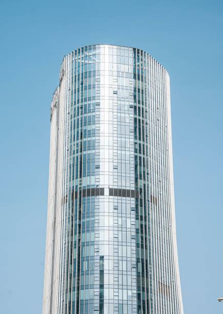 istock Modern glass skyscraper against a clear blue sky 2170491456