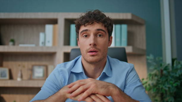 istock Man speaking interview call at home office closeup. Pensive employee consulting 2170493083