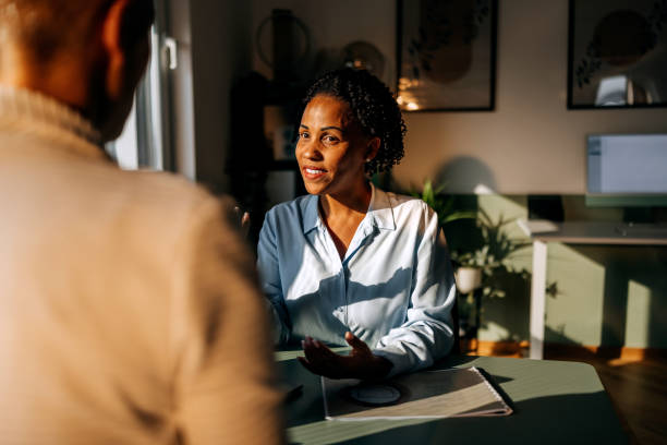 Well dressed businesswoman talking with client at the office