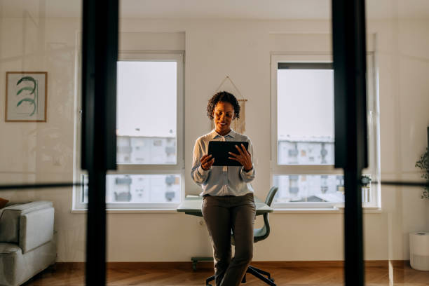 istock Well dressed businesswoman using digital tablet at the modern home office 2170493852