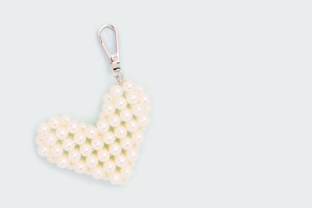 Keychain in a heart shape made from pearl imitation beads.