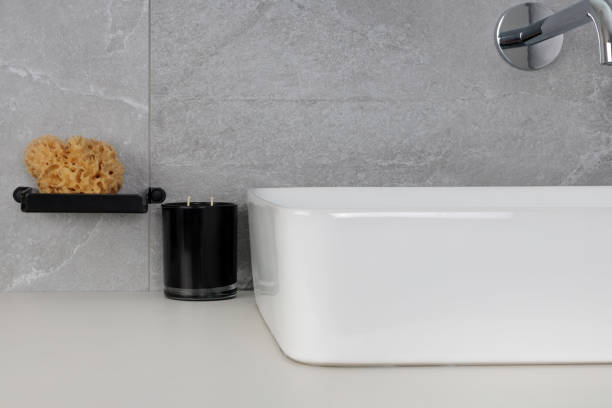 istock Minimalist Bathroom Sink with Sponge and Candle 2170494430