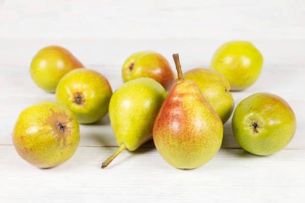 istock Fresh pears on wooden background. Selective focus 2170494598