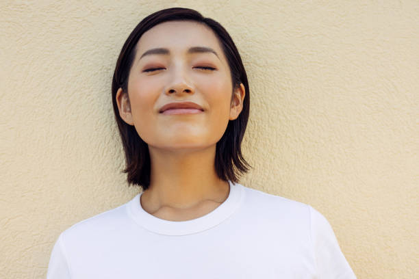Subtle Smile of a Woman with Closed Eyes