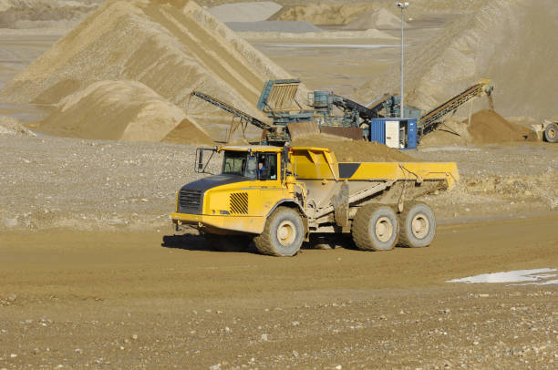 istock Yellow dump truck working in gravel pit 2170496087