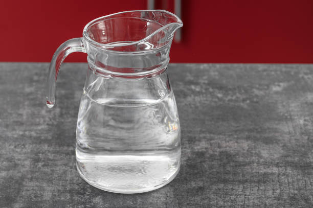 Glass jug for cold drinks filled with chilled water
