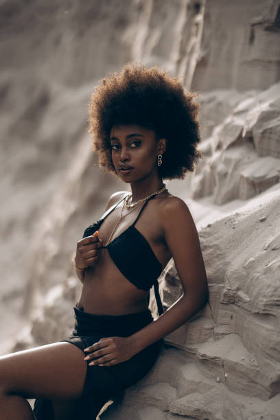 istock Pretty young african woman posing in sandy canyon. 2170497108