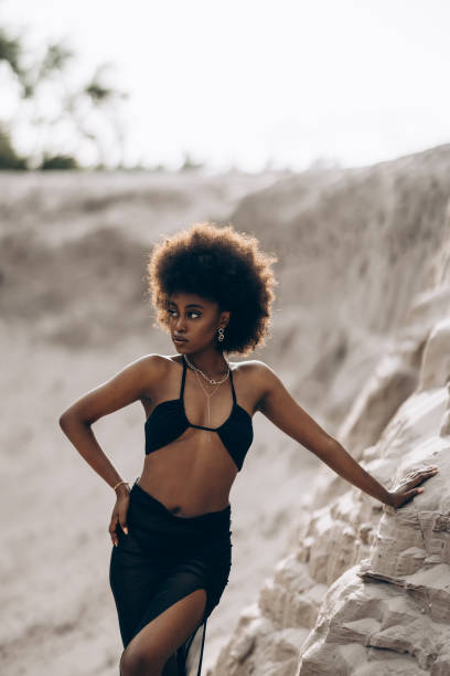 istock Pretty young african woman posing in sandy canyon. 2170497109
