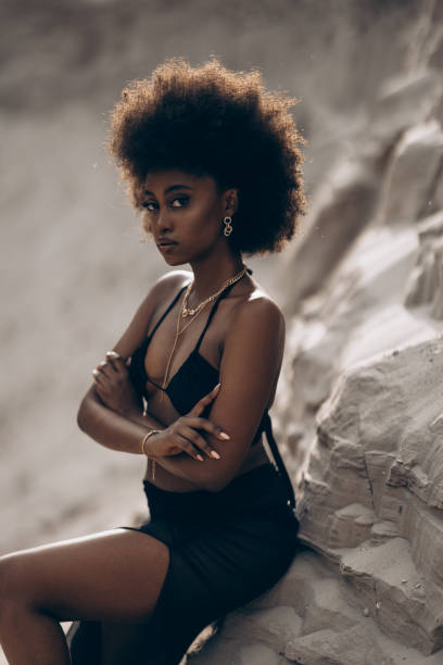istock Pretty young african woman posing in sandy canyon. 2170497113