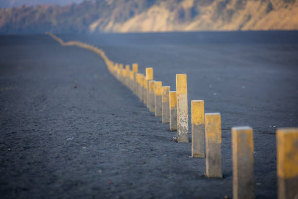 A row of stones indicates the way in the desert, Mount Bromo, East Java, Indonesia.