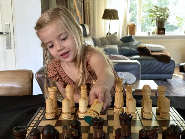 istock Toddler Girl Learning chess. 2170498393