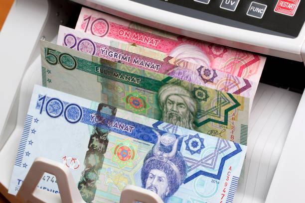 istock Turkmenistani manat in the counting machine 2170500096