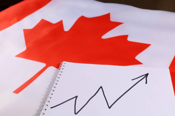 istock Canadian flag with a notebook showing an upward trend in growth 2170501174