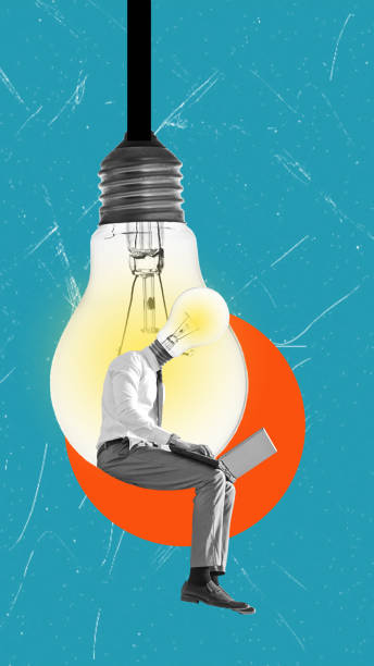 istock A developer with a laptop sits on an electric lamp. New idea. Business concept. 2170502191
