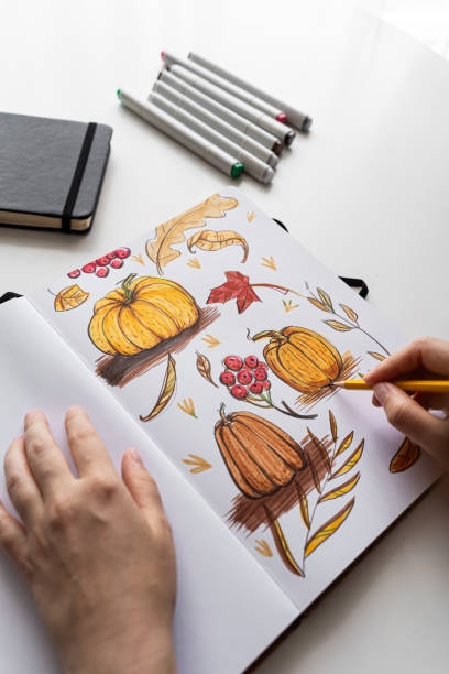 istock Hand holding marker while drawing autumn illustration 2170506432