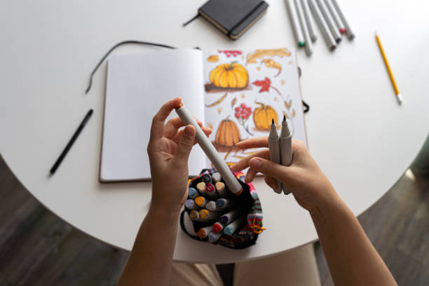 istock Hand coloring autumn-themed illustration with markers 2170506467