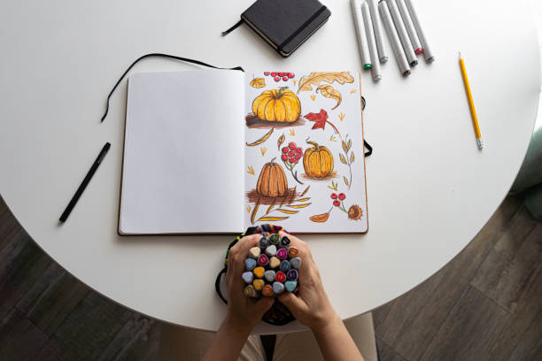 istock Hand coloring autumn-themed illustration with markers 2170506479