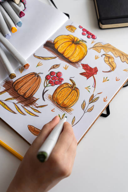 istock Hand holding marker while drawing autumn illustration 2170506586