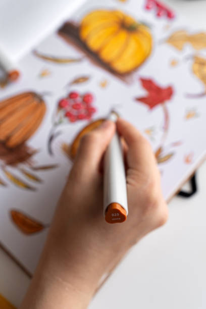 istock Hand holding marker while drawing autumn illustration 2170506650