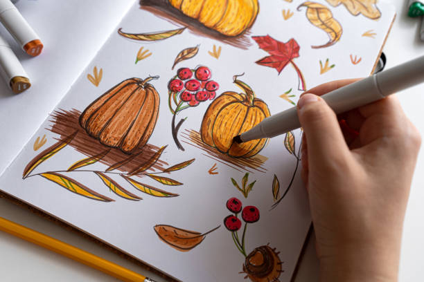 istock Hand holding marker while drawing autumn illustration 2170506742