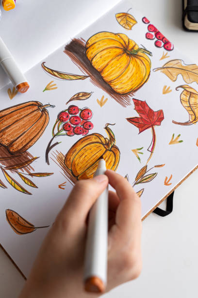istock Hand holding marker while drawing autumn illustration 2170506754