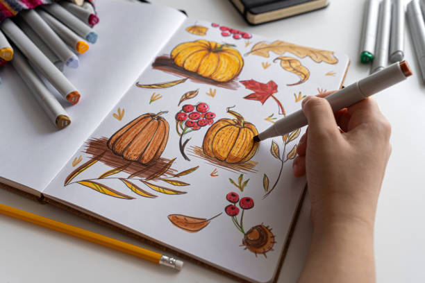 istock Hand coloring autumn-themed illustration with markers 2170506772