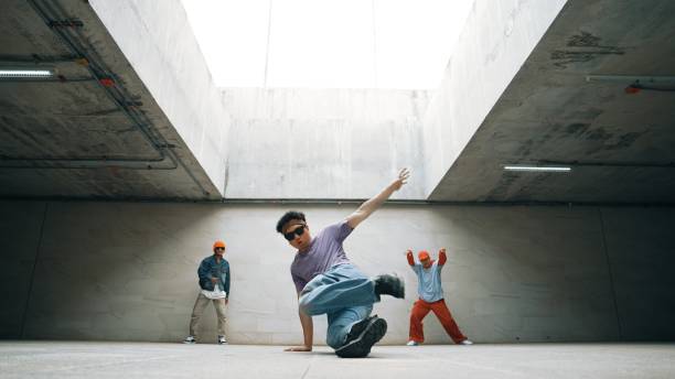 istock Group of stylish hipster group perform dancing together in building. Sprightly. 2170510412