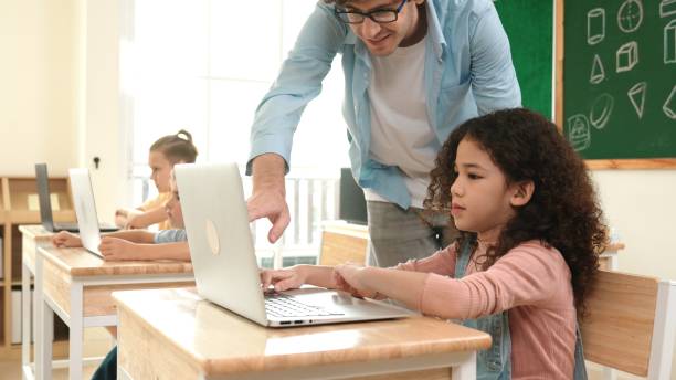 istock American girl learning about prompt while student sitting at class. Pedagogy. 2170511117