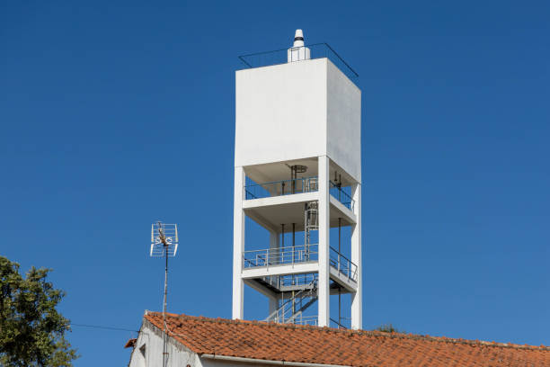 Square white water tower in a village of Portugal