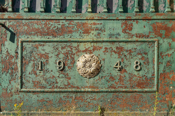 The year 1948 numbers in metal rusty green