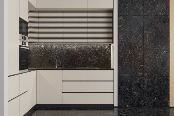 istock Modern Small L shape Kitchen with white cabinets and large black marble tiles. 2170511957