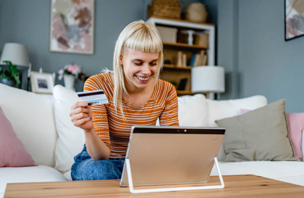 istock Woman using a tablet for online payment 2170515023