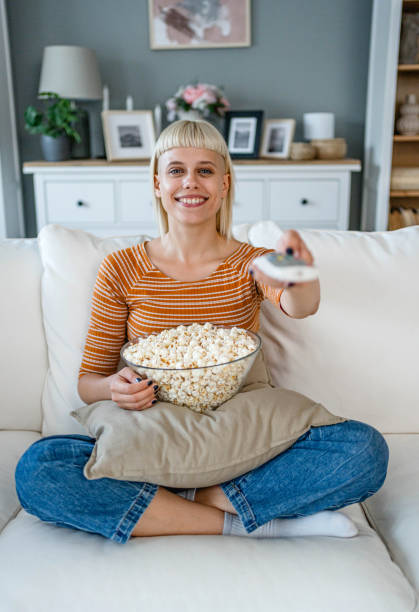 istock Woman is watching TV at home 2170515690
